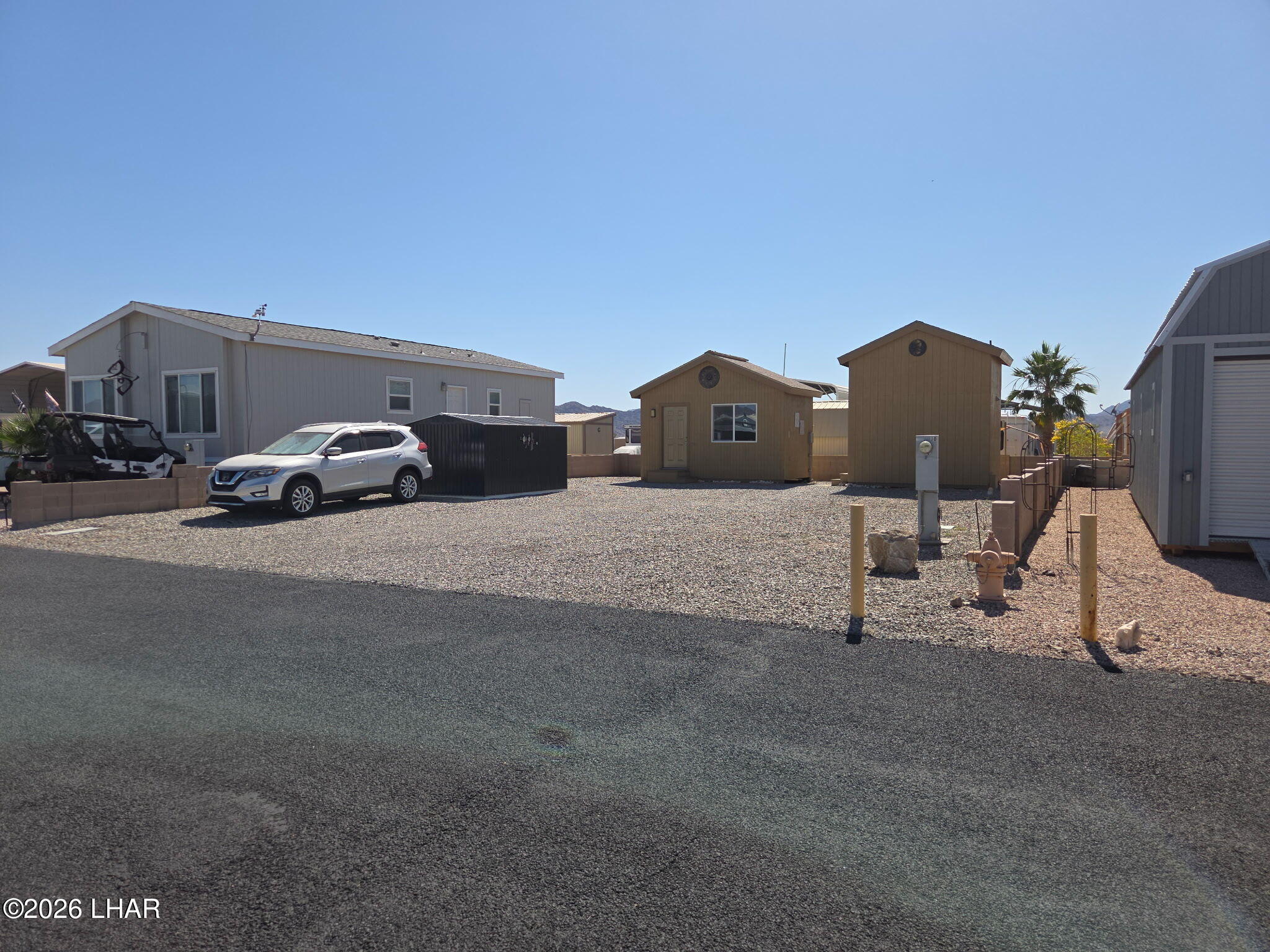 30 North Juniper Road Quartzsite, AZ 85346 - Photo 2 of 26 a car parked on the side of the road