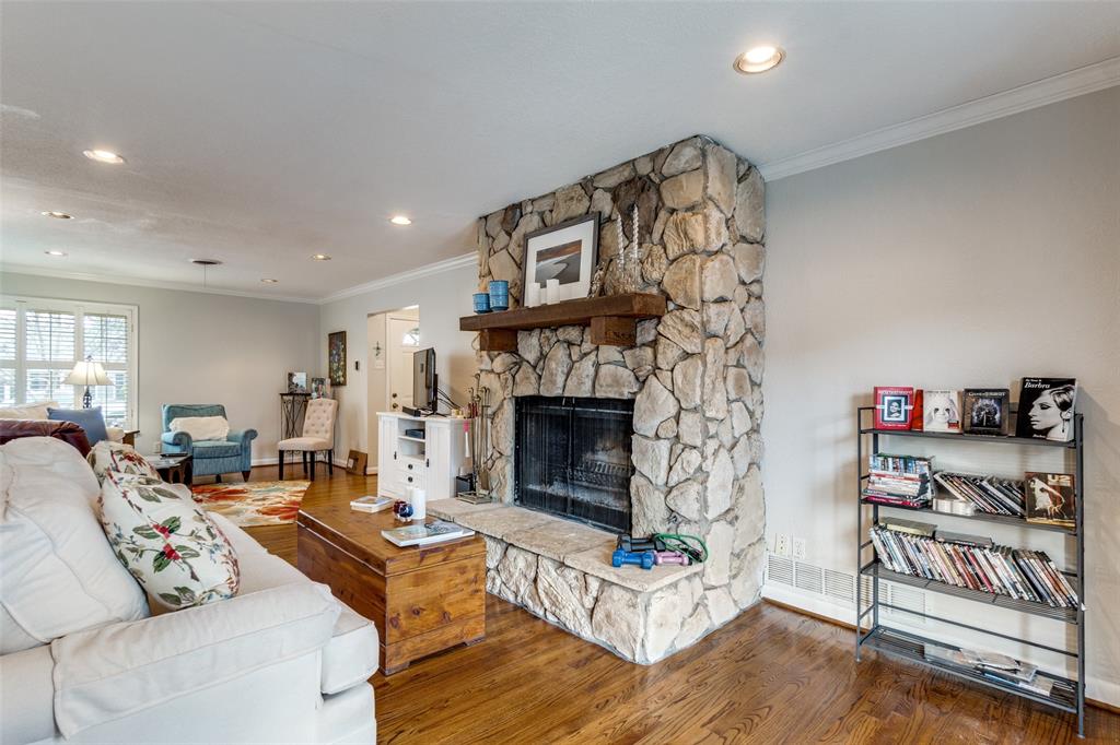 7144 Haverford Road Dallas, TX 75214 - Photo 9 of 14 a living room with furniture and a fireplace