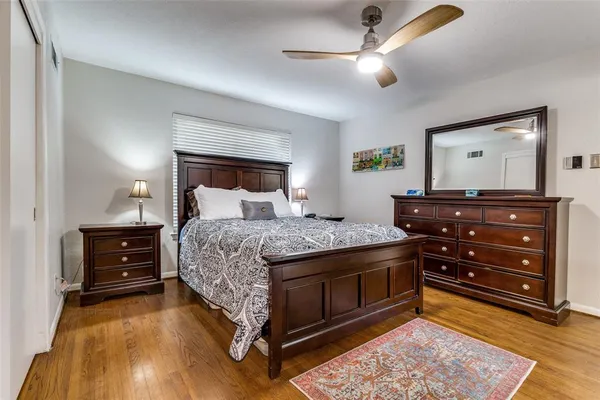 a bedroom with a bed and a dresser