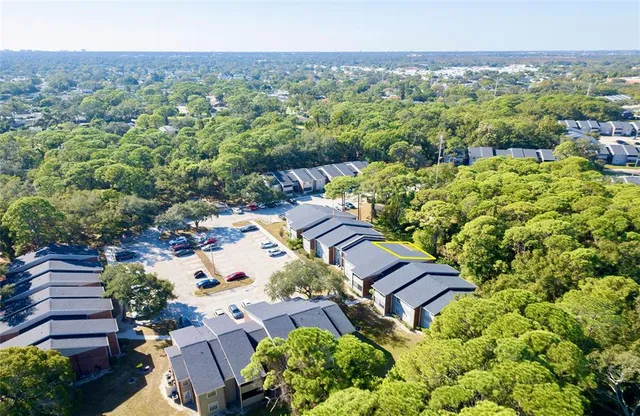 an aerial view of a house with a garden
