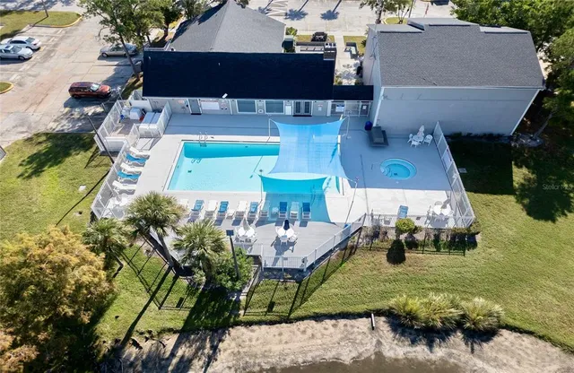 an aerial view of residential houses with outdoor space