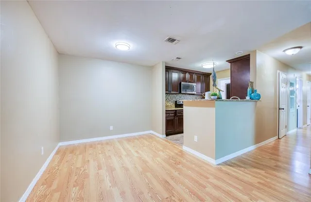 a view of kitchen with wooden floor