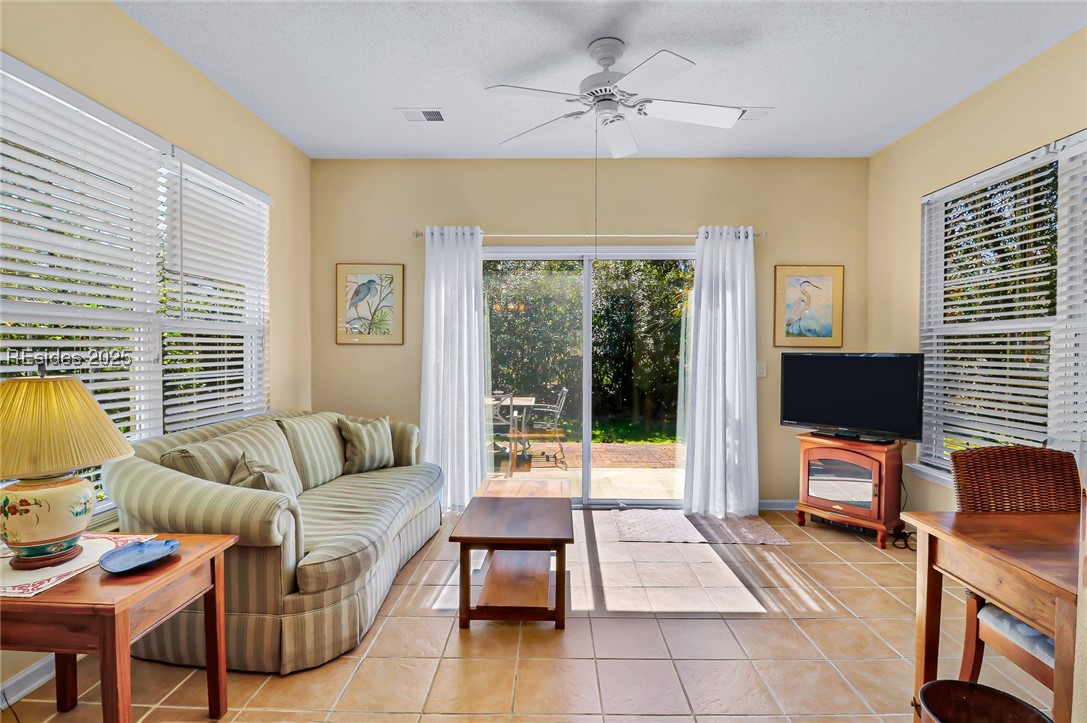 153 Landing Lane Bluffton, SC 29909 - Photo 11 of 31 Sunny Carolina Room with easy walk-out to the patio and backyard.
