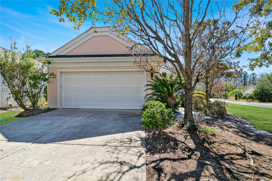 153 Landing Lane Bluffton, SC 29909 - Photo 24 of 31 Garage and driveway