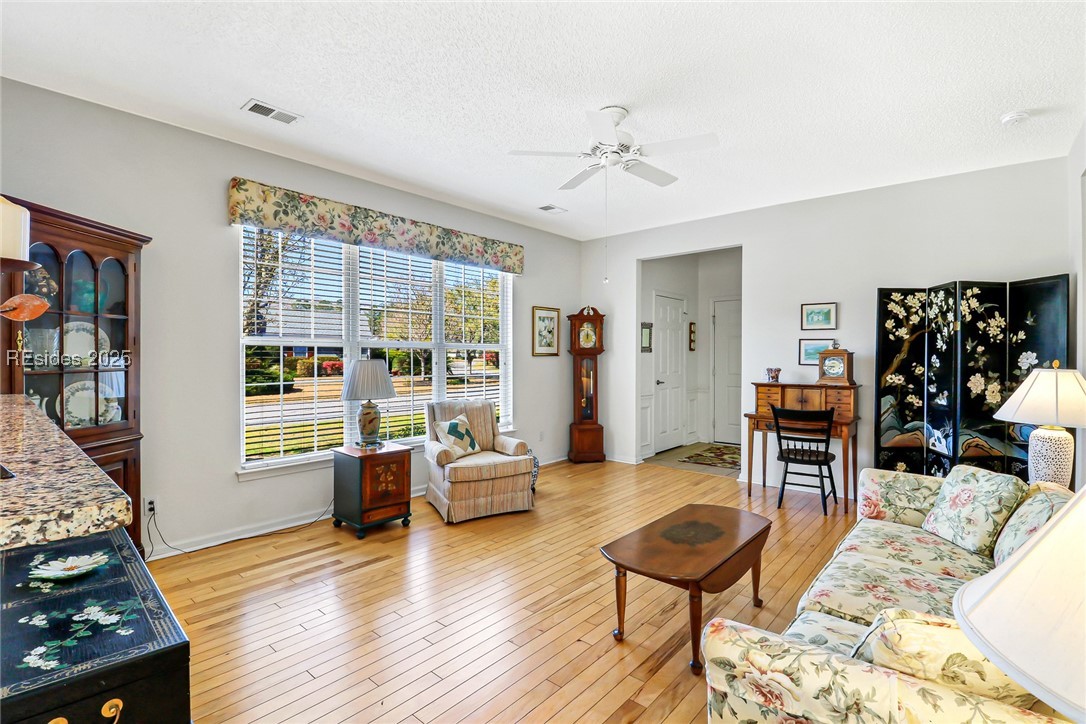 153 Landing Lane Bluffton, SC 29909 - Photo 6 of 31 View of the living area from the kitchen passage way.
