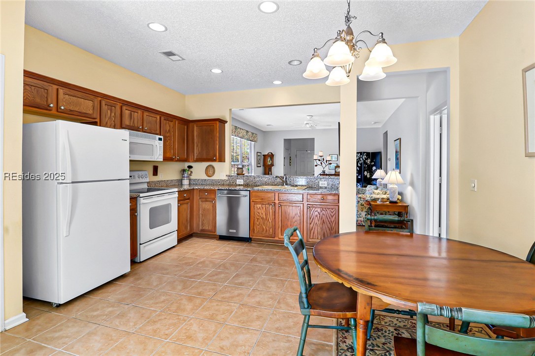 153 Landing Lane Bluffton, SC 29909 - Photo 9 of 31 Eat-in kitchen with tile flooring.
