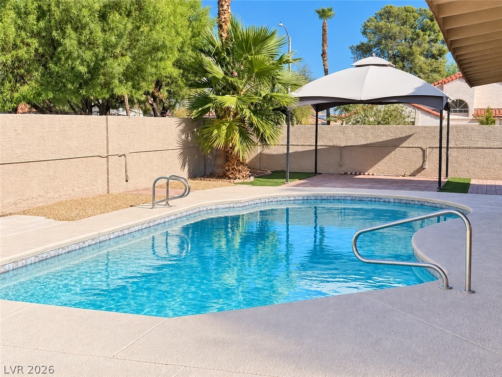 43 Bayridge Road Henderson, NV 89074 - Photo 8 of 47 A sparkling swimming pool highlights this private backyard retreat enclosed by a solid masonry wall.
