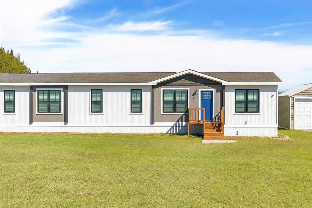 4504 Bethany Road Sherman, TX 75090 - Photo 17 of 20 a front view of a house with a garden and yard