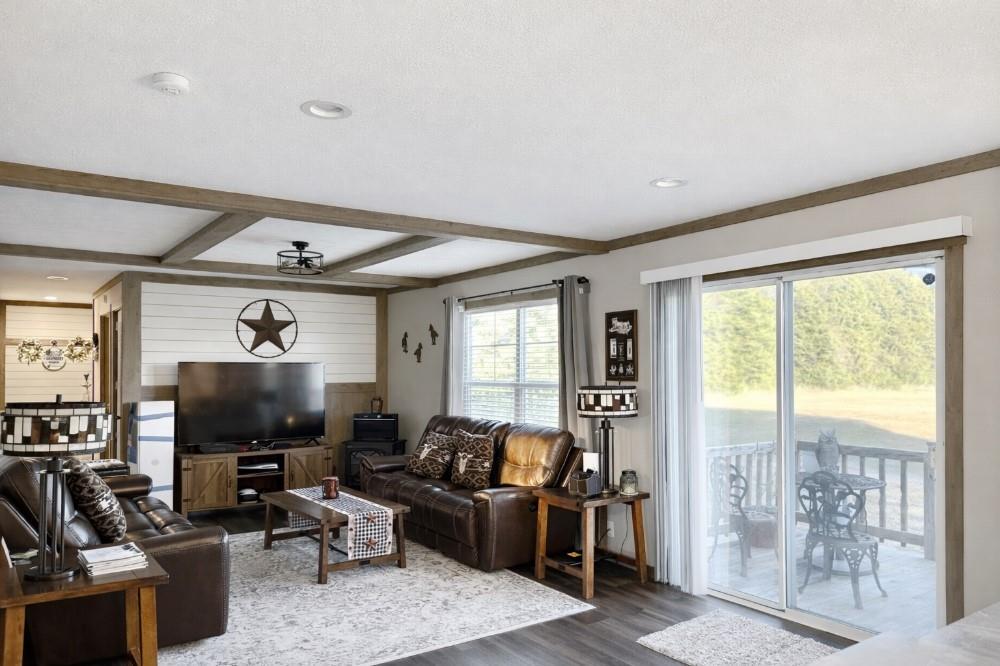 4504 Bethany Road Sherman, TX 75090 - Photo 18 of 20 a living room with furniture and a flat screen tv
