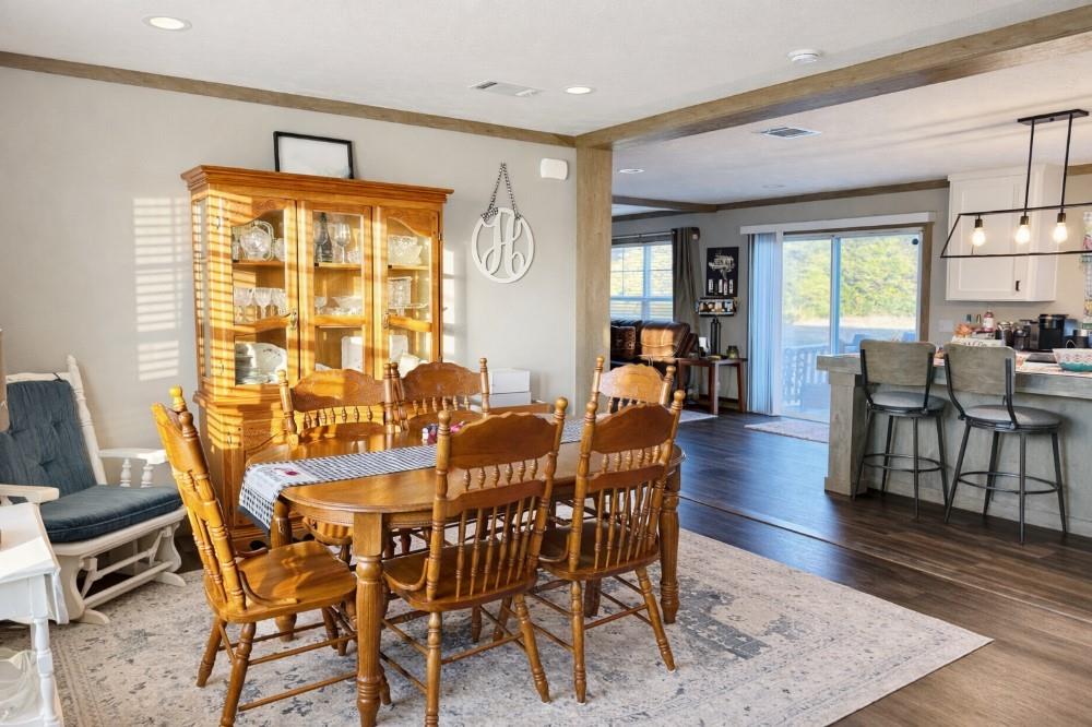 4504 Bethany Road Sherman, TX 75090 - Photo 19 of 20 a view of a dining room with furniture window and wooden floor