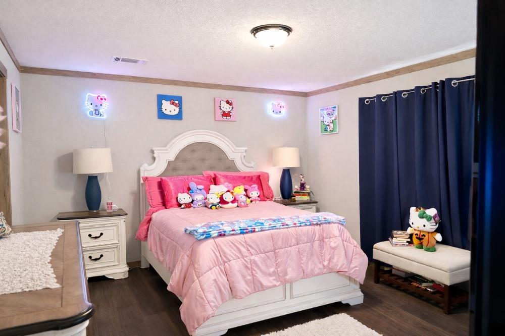 4504 Bethany Road Sherman, TX 75090 - Photo 8 of 20 a bedroom with a bed and wooden floor