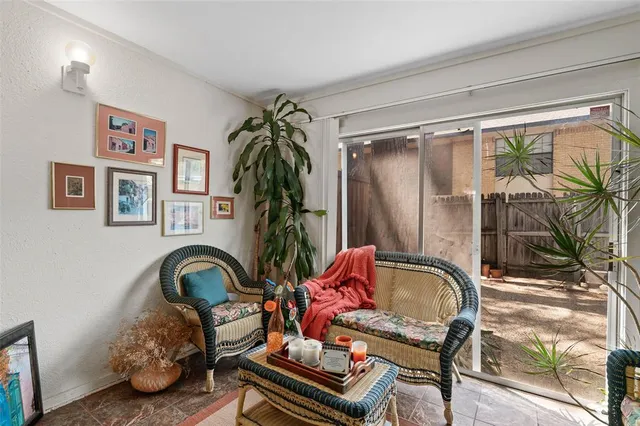 a front view of a house with outdoor seating