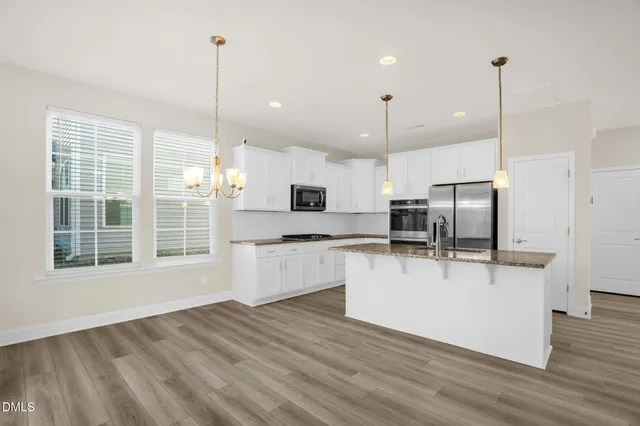 a view of kitchen with wooden floor