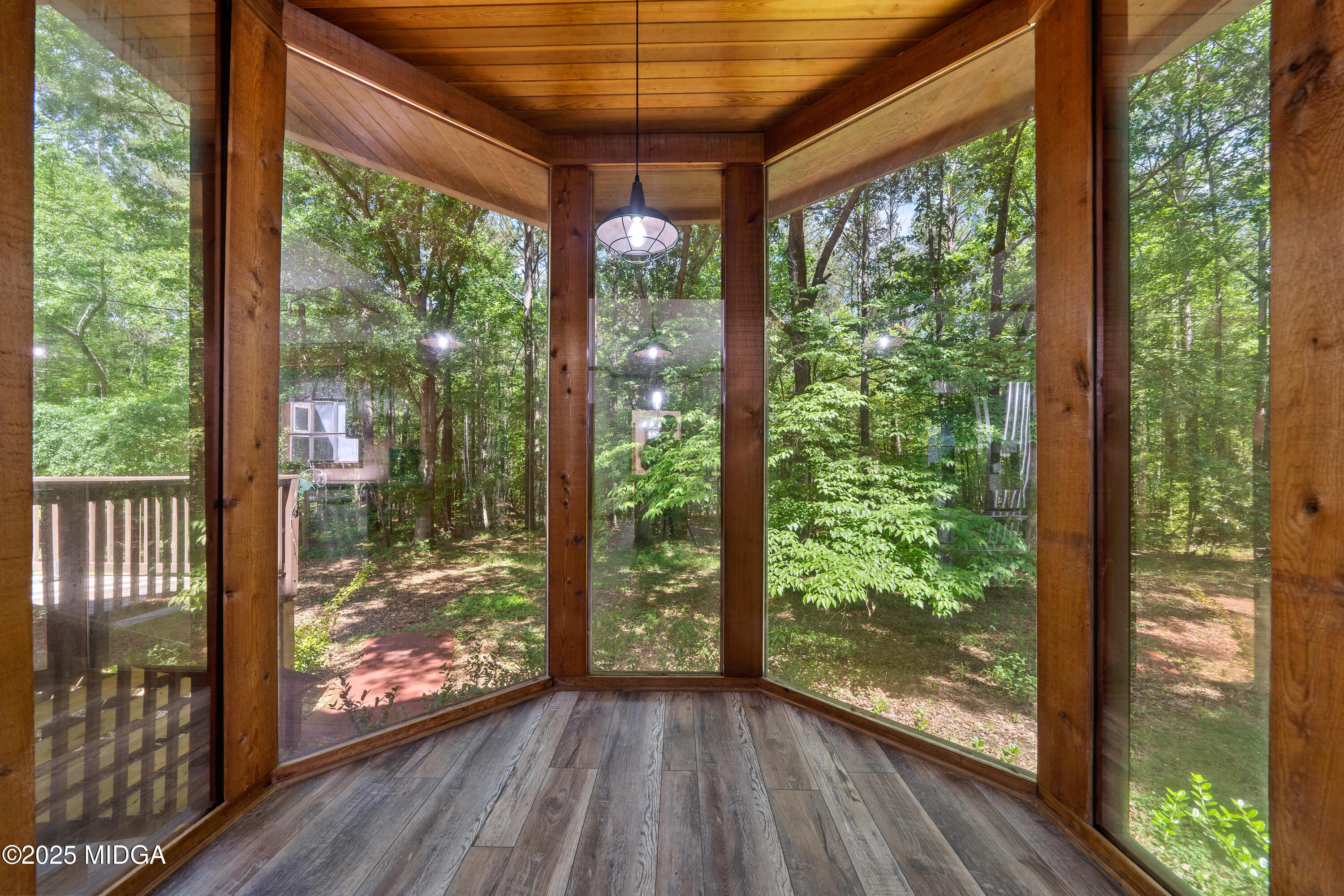 1627 Leguin Mill Road Locust Grove, GA 30248 - Photo 11 of 49 a view of a room with wooden floor and doors