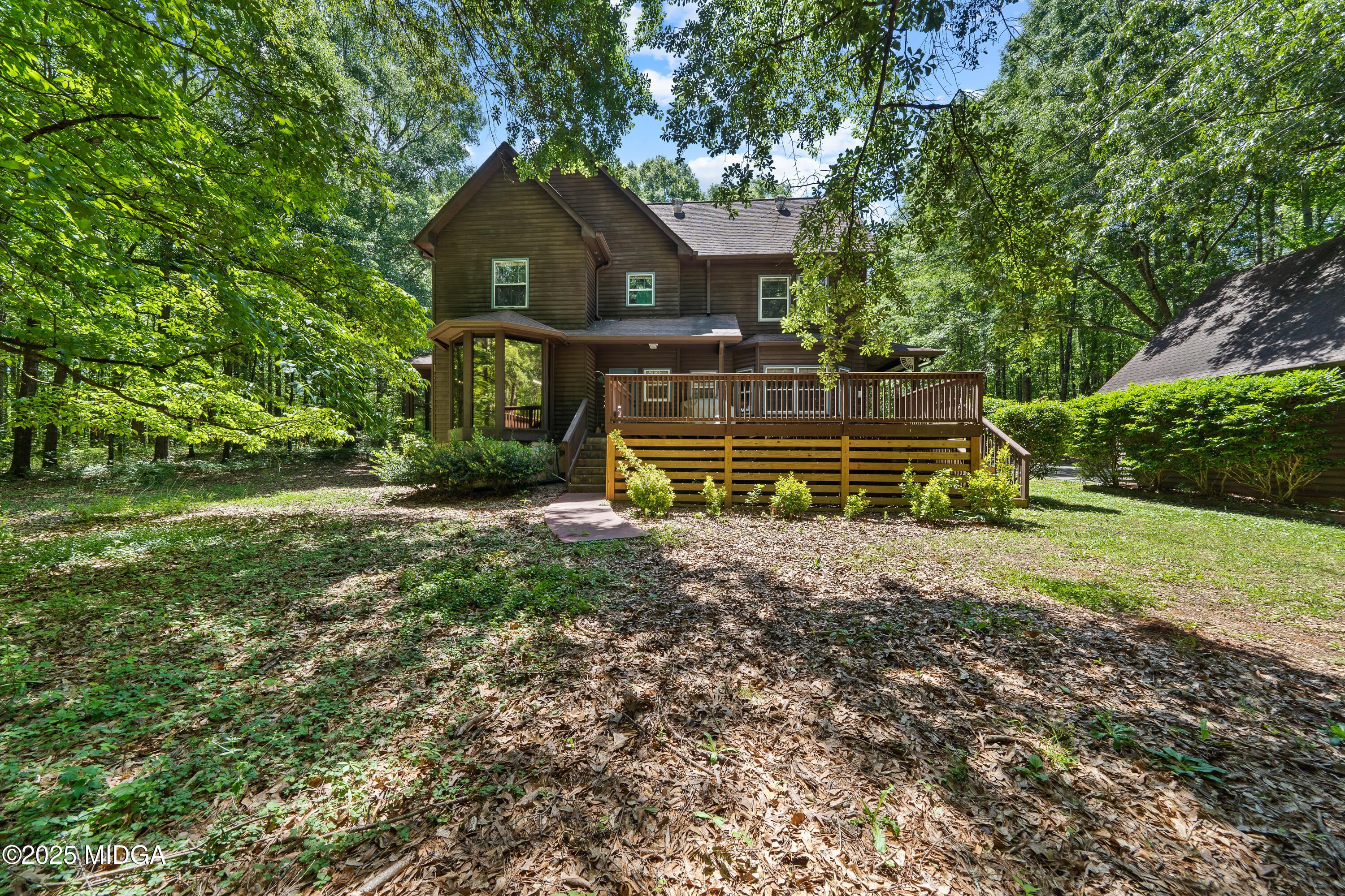 1627 Leguin Mill Road Locust Grove, GA 30248 - Photo 17 of 49 a front view of a house with a yard
