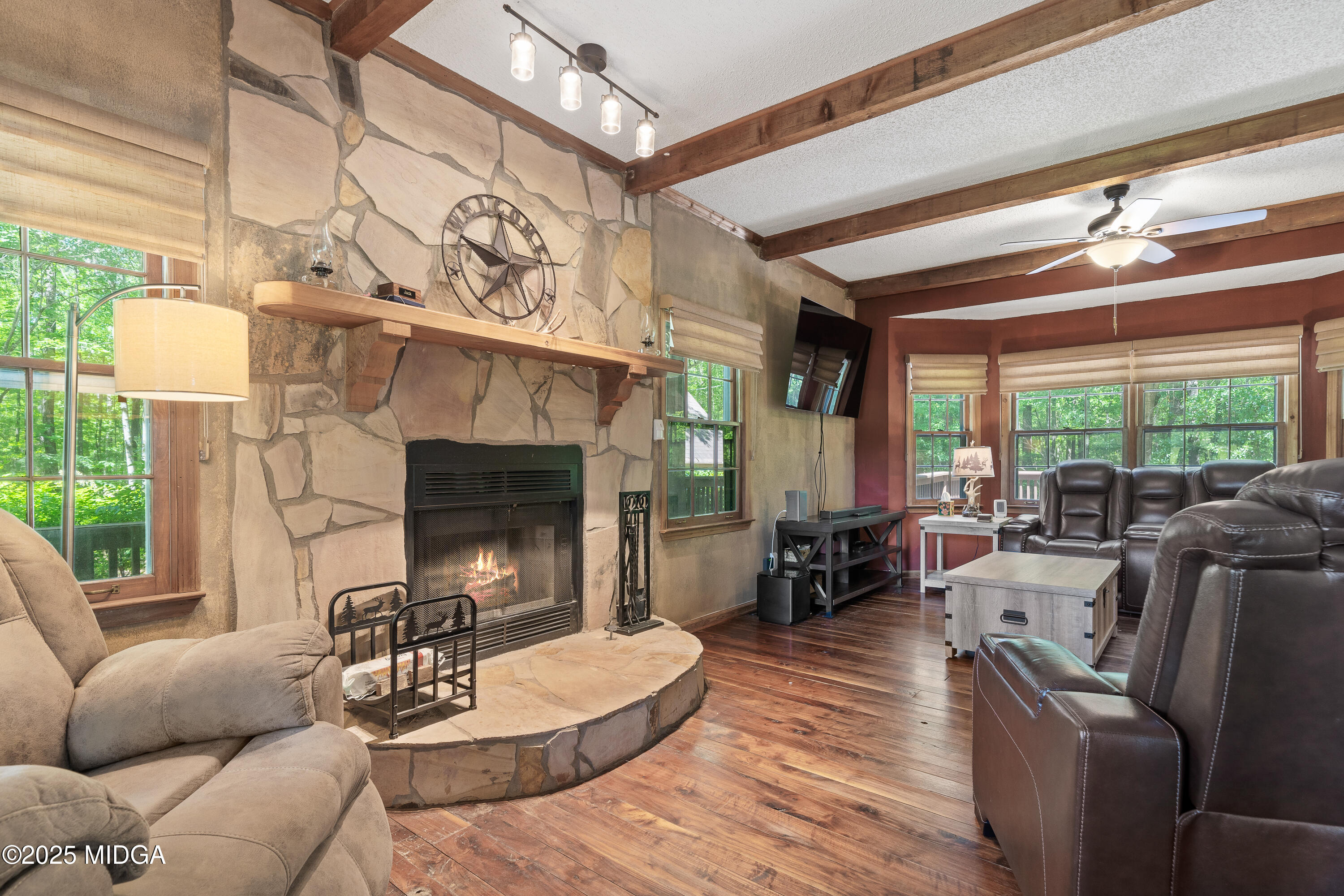 1627 Leguin Mill Road Locust Grove, GA 30248 - Photo 21 of 49 a living room with furniture and a fireplace
