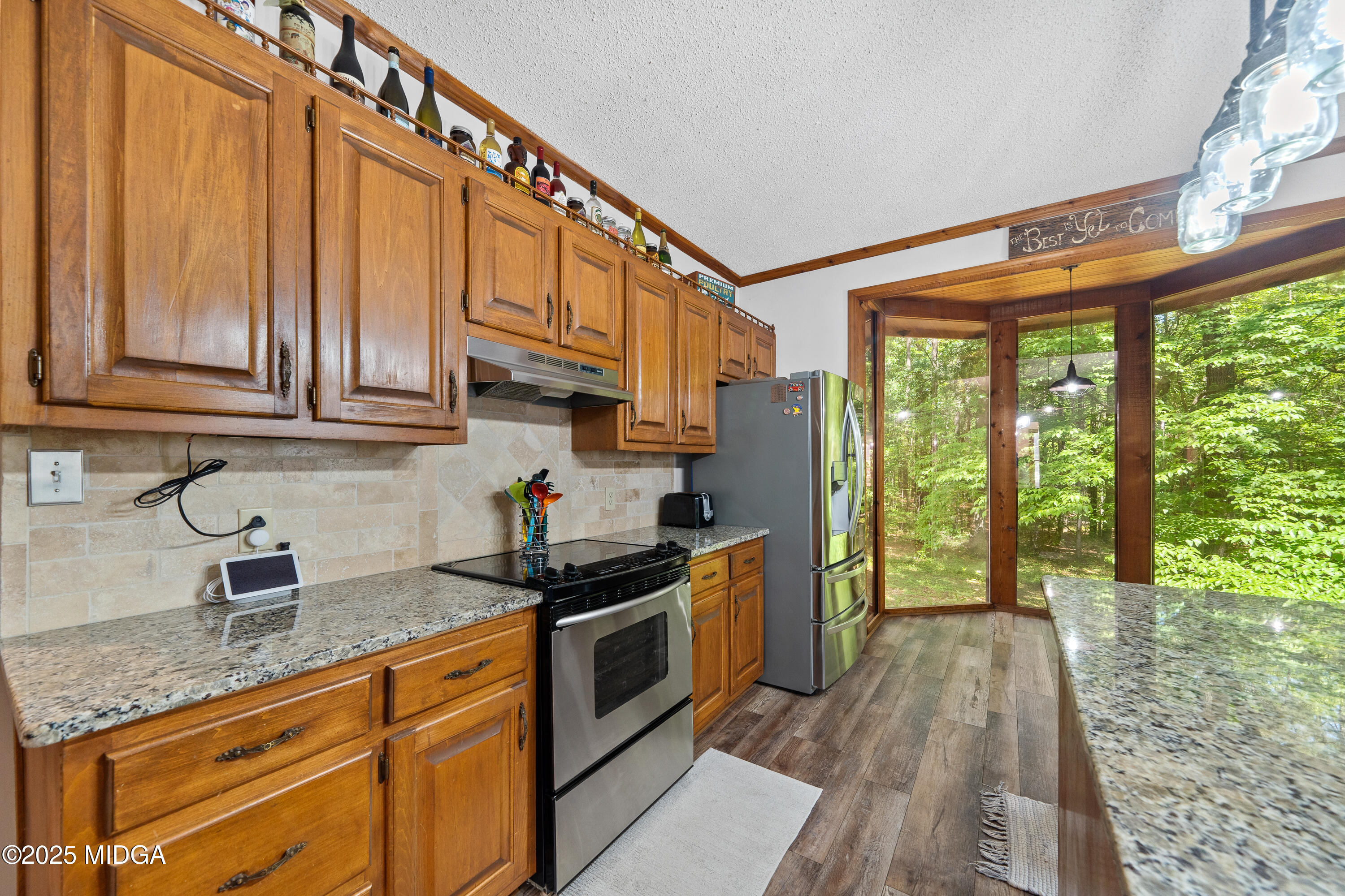 1627 Leguin Mill Road Locust Grove, GA 30248 - Photo 27 of 49 a kitchen with stainless steel appliances granite countertop a stove a sink and cabinets