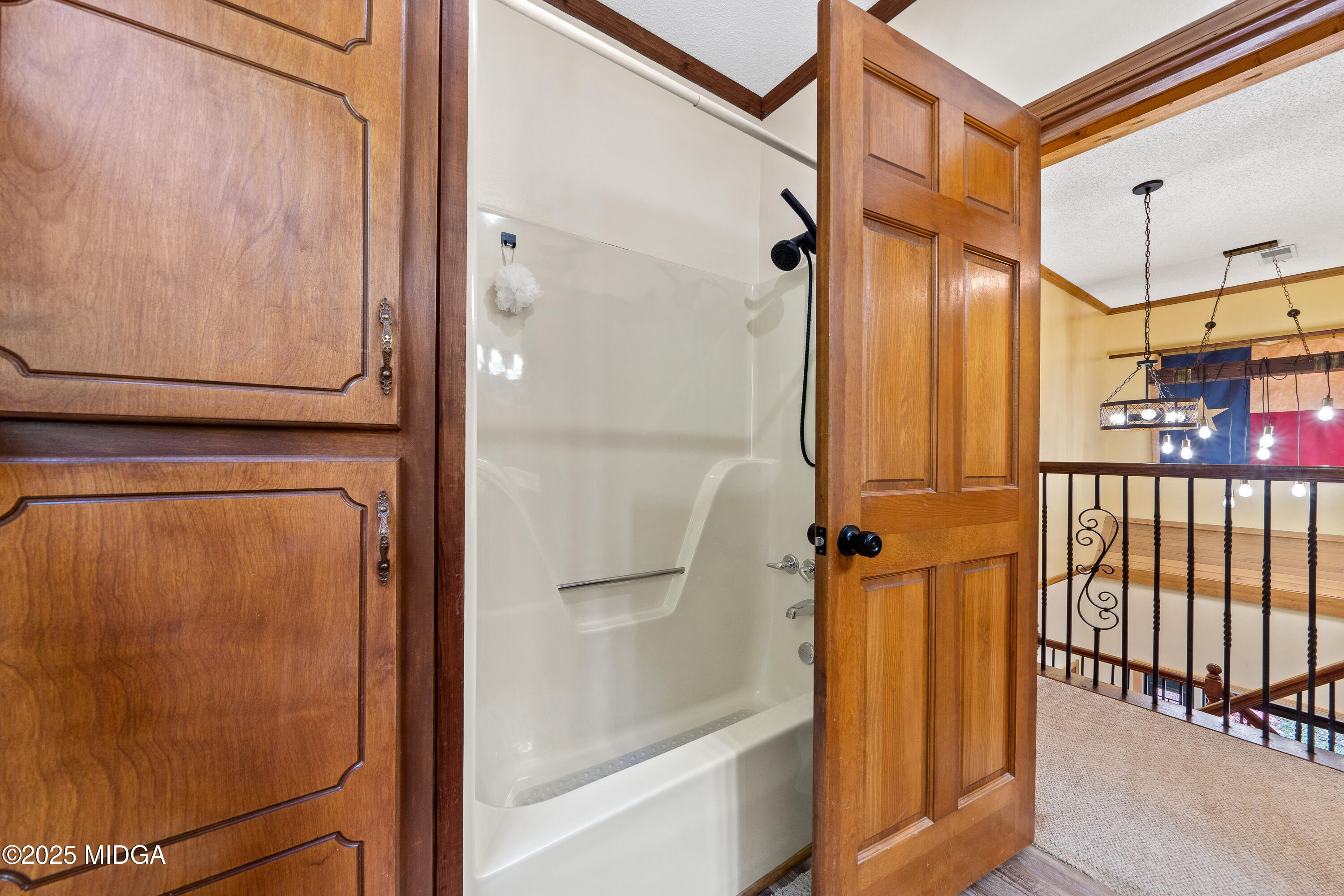 1627 Leguin Mill Road Locust Grove, GA 30248 - Photo 35 of 49 a bathroom with a mirror and a shower
