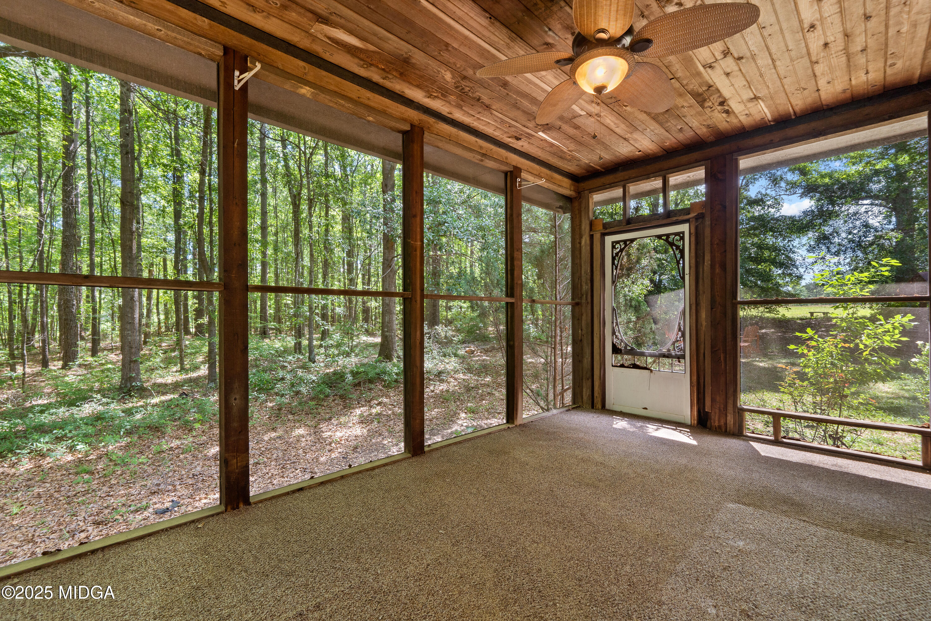 1627 Leguin Mill Road Locust Grove, GA 30248 - Photo 9 of 49 Screened Porch with door to fire pit are