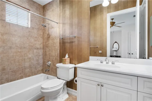 a view of a house with swimming pool and sitting area