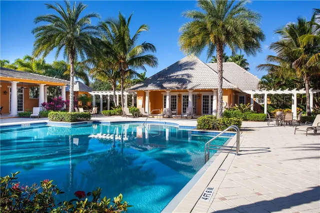 an aerial view of a house with garden space and sitting area
