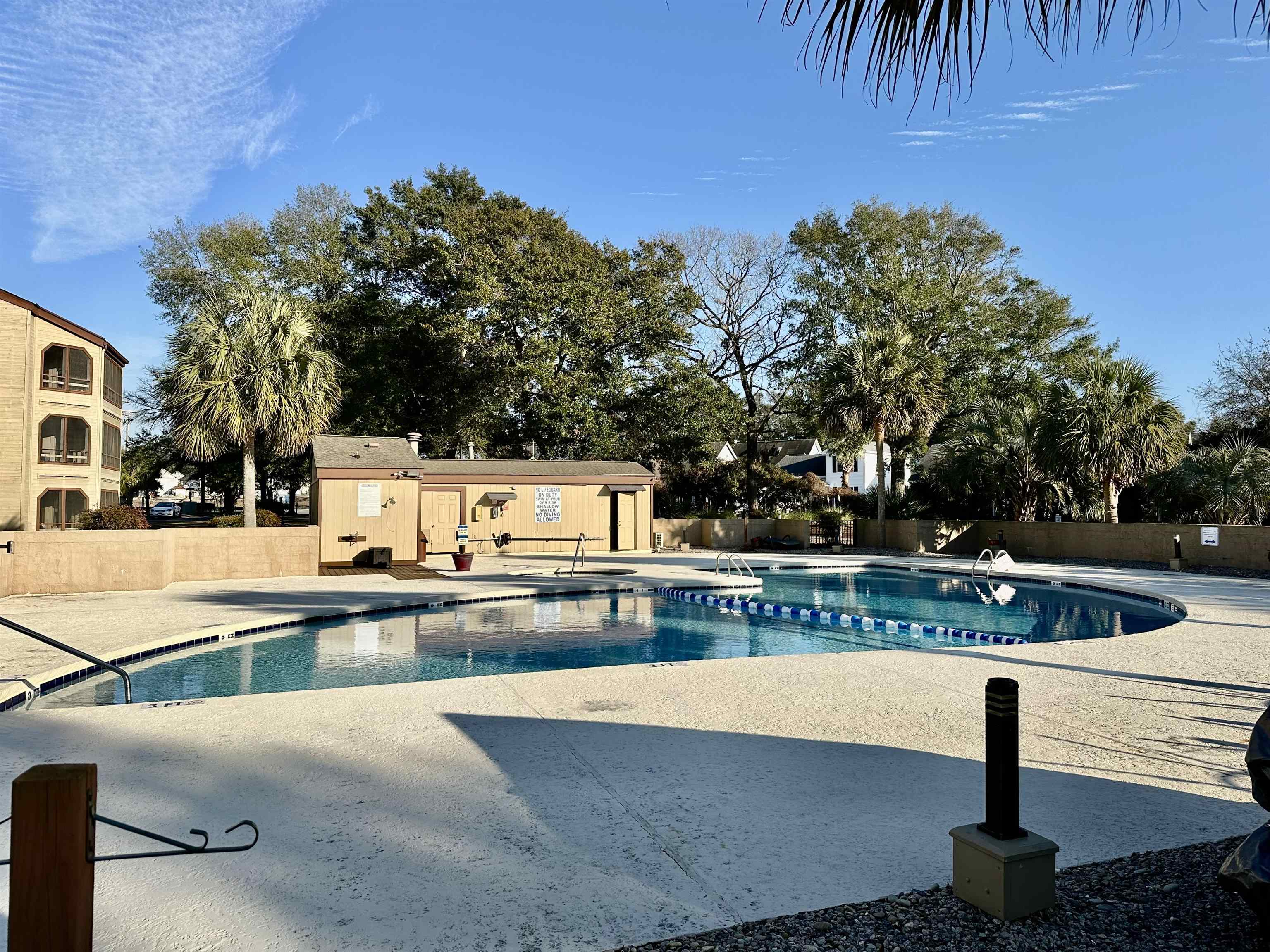 501 Maison Drive, Unit C9 Myrtle Beach, SC 29572 - Photo 22 of 27 Community pool with a patio and an outbuilding