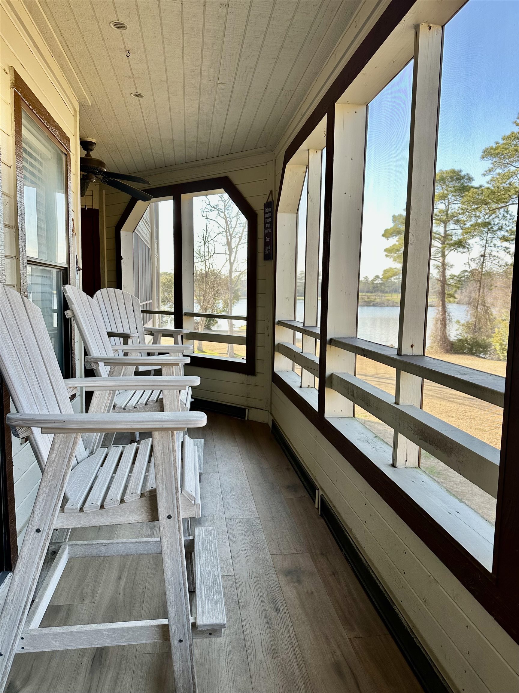501 Maison Drive, Unit C9 Myrtle Beach, SC 29572 - Photo 4 of 27 Unfurnished sunroom featuring wood walls, a water view, wooden ceiling, plenty of natural light, and hardwood / wood-style flooring