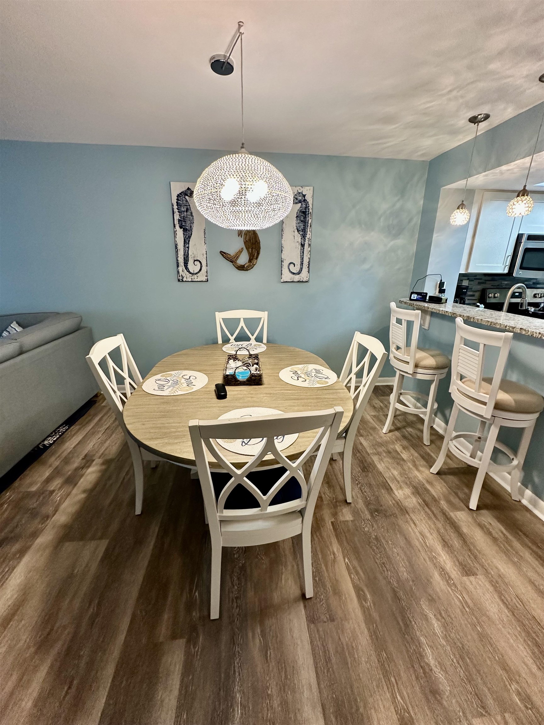 501 Maison Drive, Unit C9 Myrtle Beach, SC 29572 - Photo 7 of 27 Dining area featuring dark wood finished floors and a chandelier