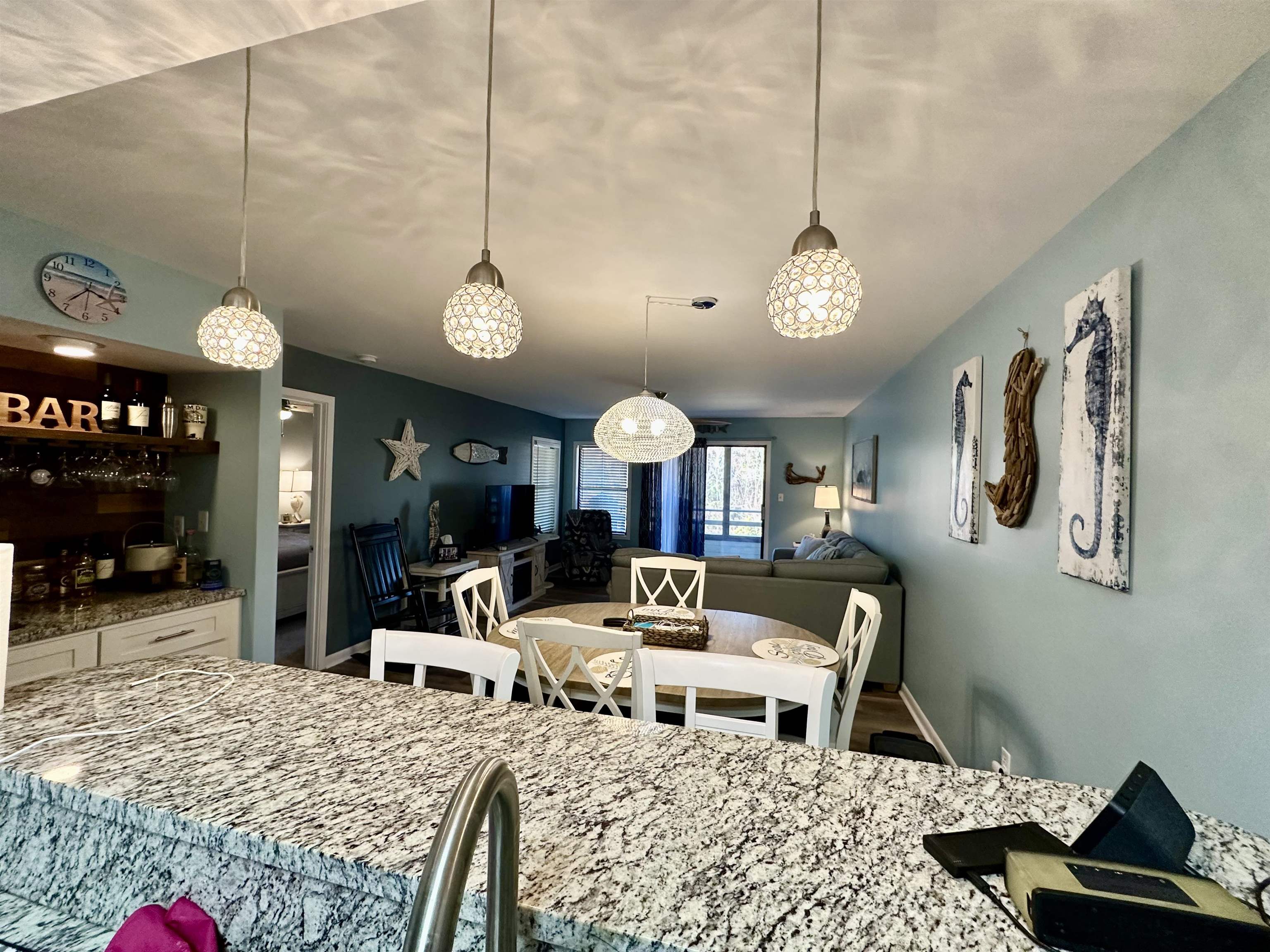501 Maison Drive, Unit C9 Myrtle Beach, SC 29572 - Photo 9 of 27 Dining room with a dry bar and wood finished floors
