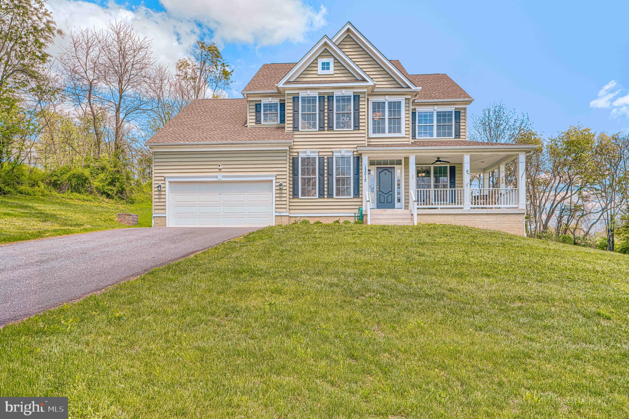 13012 Liberty Road Union Bridge, MD 21791 - Photo 1 of 47 a front view of a house with a garden