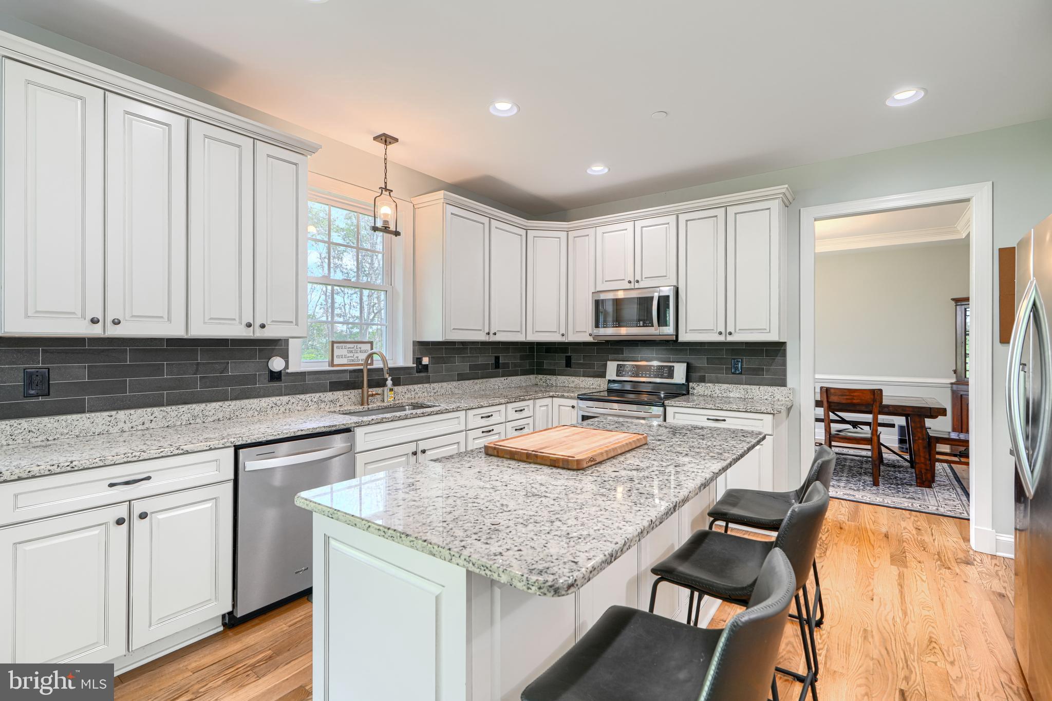 13012 Liberty Road Union Bridge, MD 21791 - Photo 13 of 47 a kitchen with sink refrigerator and cabinets