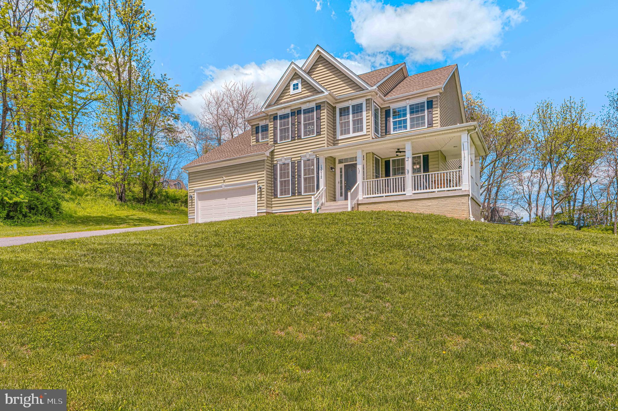 13012 Liberty Road Union Bridge, MD 21791 - Photo 2 of 47 a front view of a house with a garden