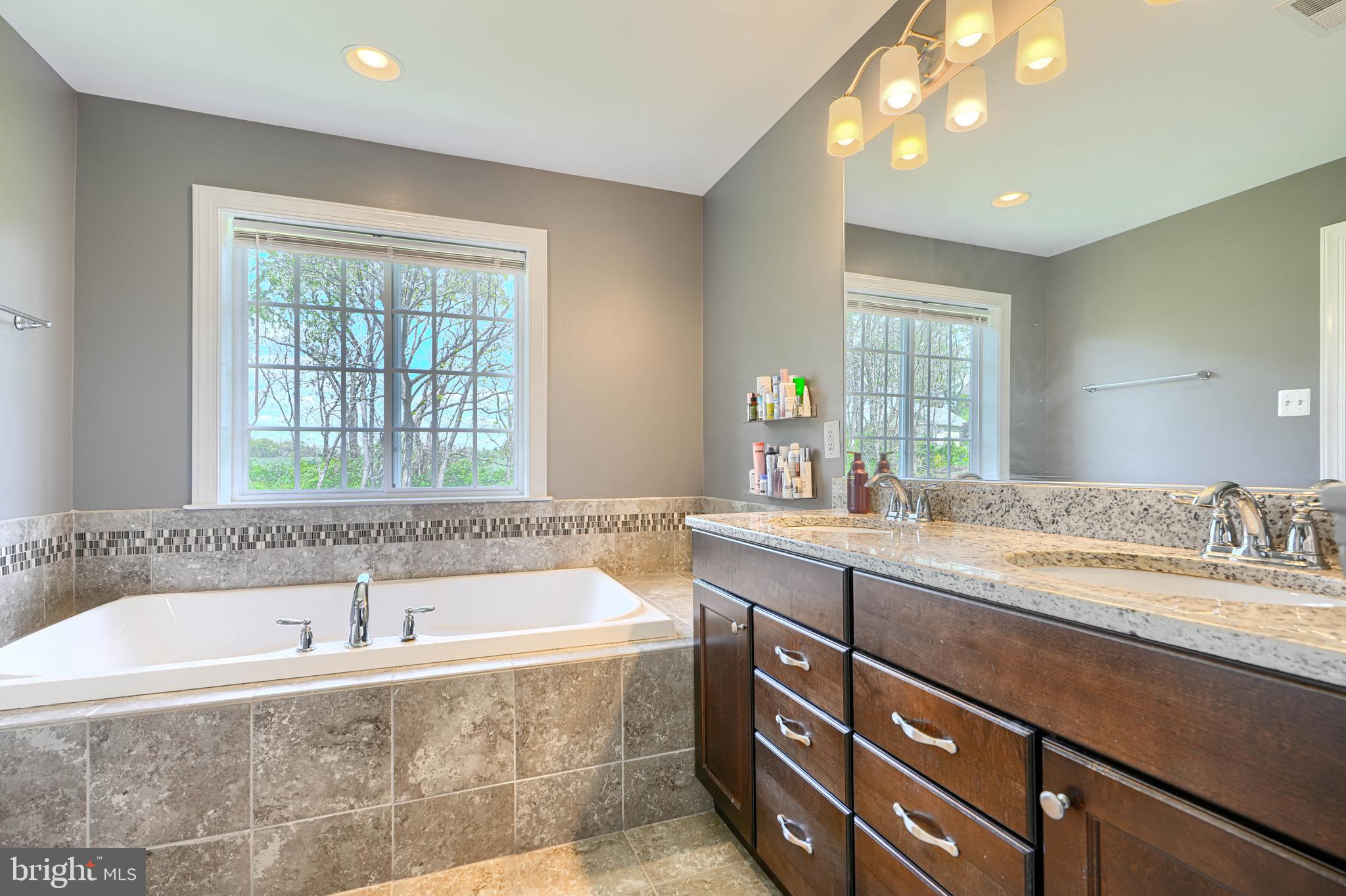 13012 Liberty Road Union Bridge, MD 21791 - Photo 27 of 47 a bathroom with a granite countertop sink mirror bathtub and double