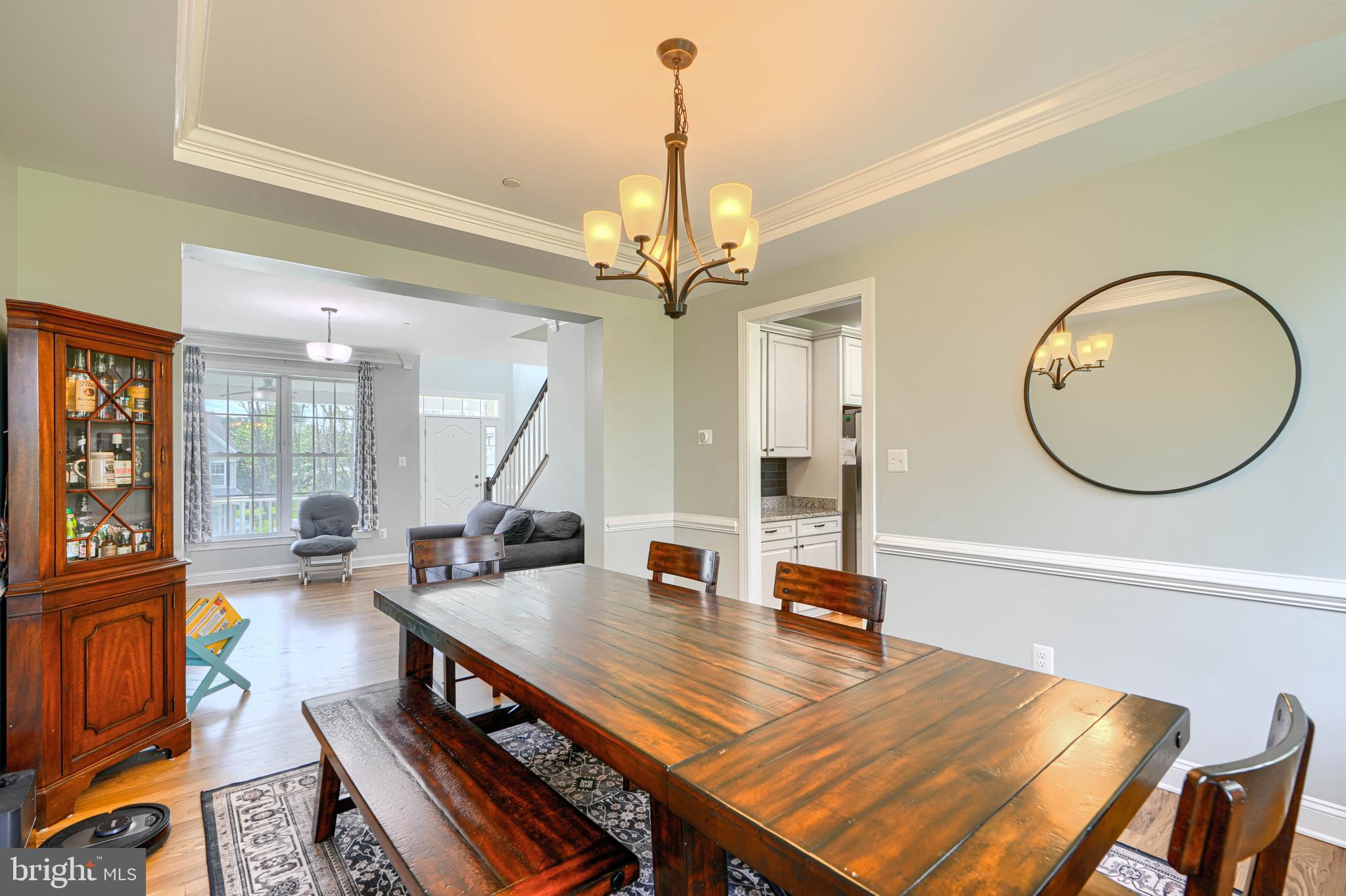 13012 Liberty Road Union Bridge, MD 21791 - Photo 10 of 47 a living room with furniture a mirror and a chandelier