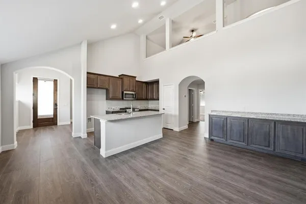 a view of living room with furniture and wooden floor
