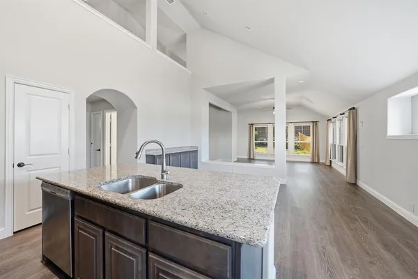 a kitchen with a sink and natural light