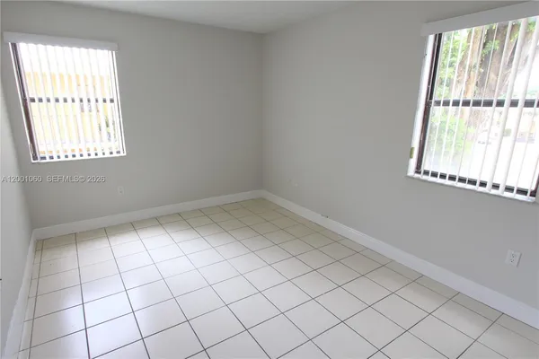 an empty room with windows