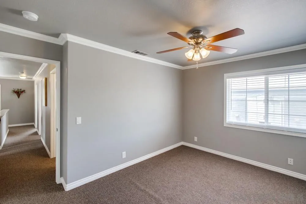 880 Friendly Circle El Cajon, CA 92021 - Photo 18 of 27 an empty room with a window and a ceiling fan