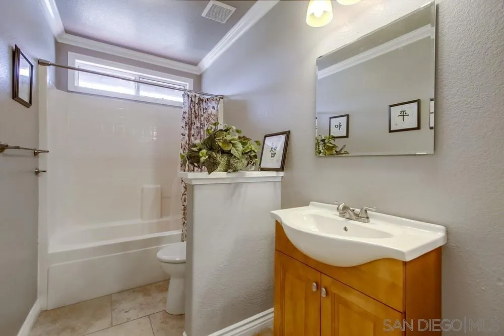 880 Friendly Circle El Cajon, CA 92021 - Photo 21 of 27 a bathroom with a sink toilet and shower