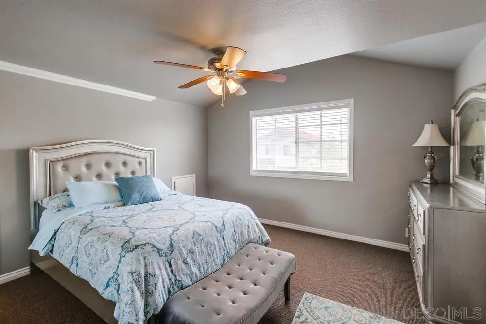 880 Friendly Circle El Cajon, CA 92021 - Photo 22 of 27 a bedroom with a bed and a window