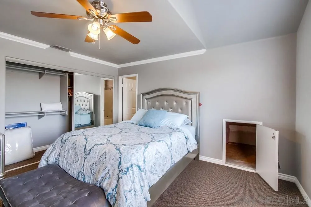 880 Friendly Circle El Cajon, CA 92021 - Photo 23 of 27 a bedroom with a bed and a ceiling fan