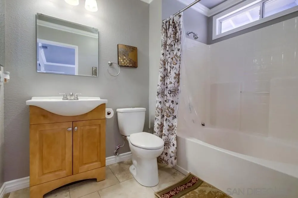 880 Friendly Circle El Cajon, CA 92021 - Photo 26 of 27 a bathroom with a sink toilet and shower
