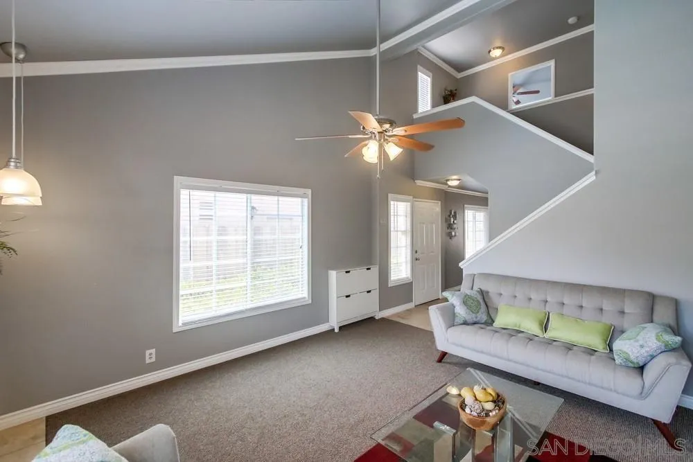 880 Friendly Circle El Cajon, CA 92021 - Photo 4 of 27 a living room with furniture and a chandelier