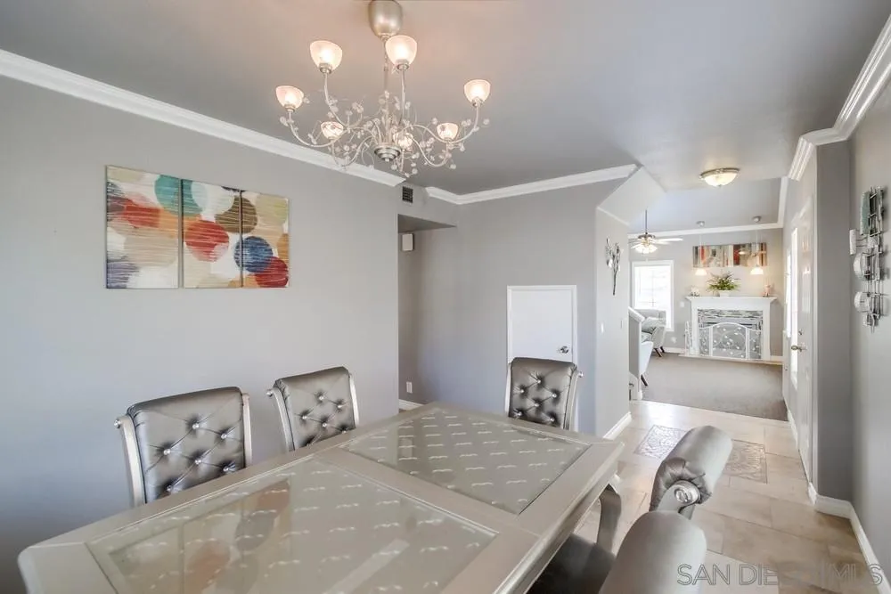 880 Friendly Circle El Cajon, CA 92021 - Photo 7 of 27 a bedroom with furniture and a chandelier