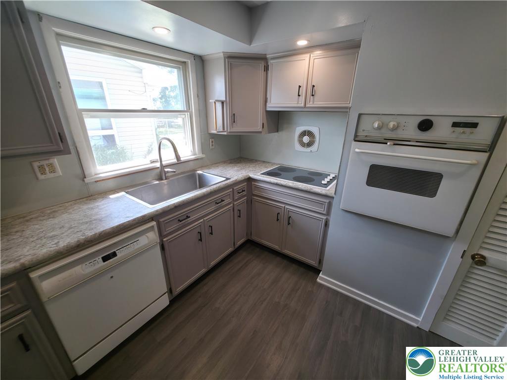 719 Keystone Avenue Bethlehem, PA 18018 - Photo 12 of 32 Functional kitchen with ample counter space and well-maintained cabinetry awaits culinary creativity.