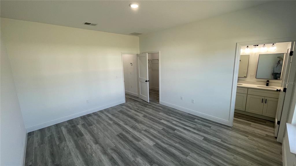 15282 Southwest 65th Avenue Road Ocala, FL 34473 - Photo 20 of 33 a view of a kitchen from the hallway