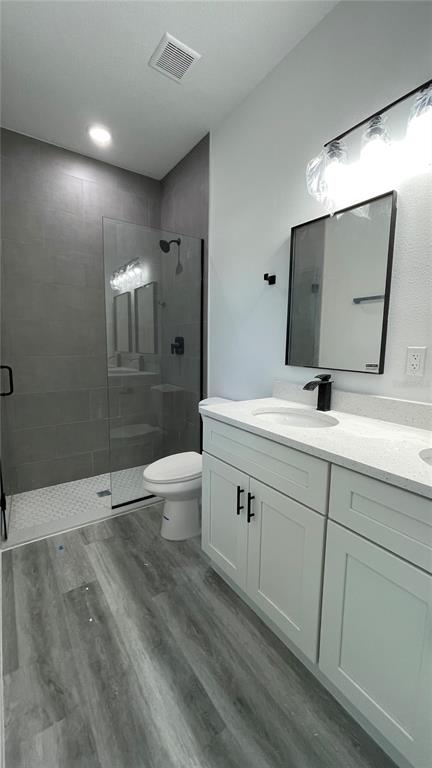 15282 Southwest 65th Avenue Road Ocala, FL 34473 - Photo 22 of 33 a bathroom with double sink and a large mirror