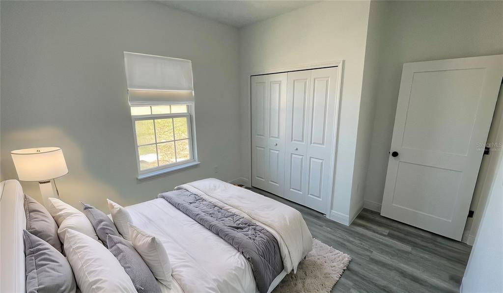 15282 Southwest 65th Avenue Road Ocala, FL 34473 - Photo 27 of 33 a bedroom with a bed and a window