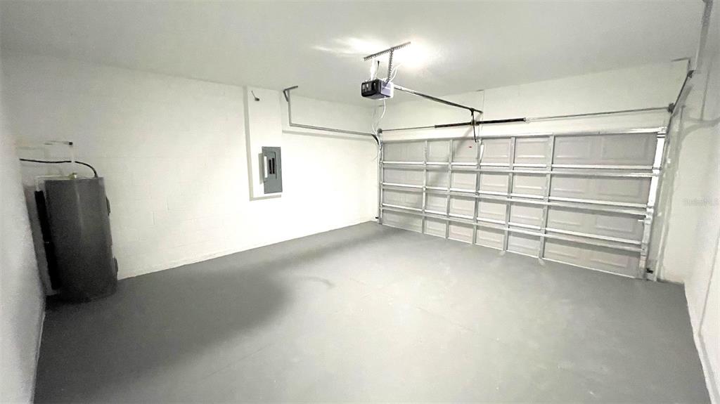 15282 Southwest 65th Avenue Road Ocala, FL 34473 - Photo 33 of 33 a view of a garage room and a ceiling fan