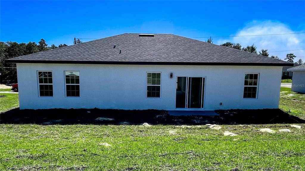 15282 Southwest 65th Avenue Road Ocala, FL 34473 - Photo 7 of 33 a house that has tree in front of it